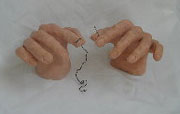 Hands Threading Needle Sculpture